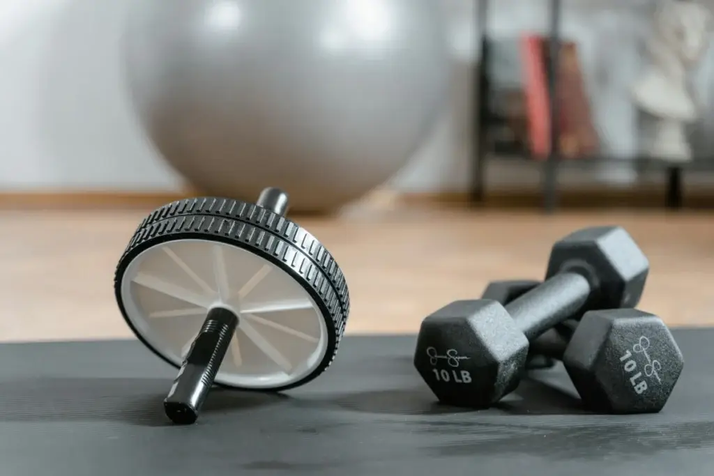 Evidence-based fitness coaching and online programming - barbell and workout equipment